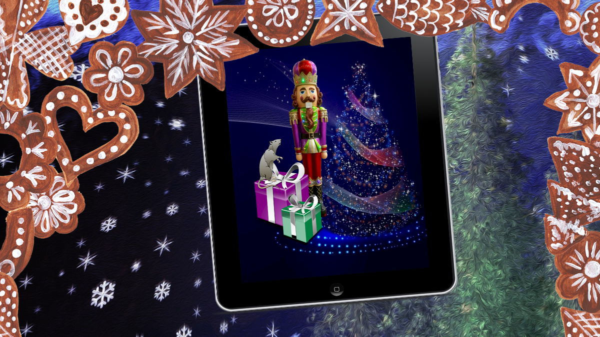 A snowy winter forest at night, with decorated gingerbread cookies falling like snowflakes, and a tablet displaying a Nutcracker soldier dressed in red, purple, green and gold, with a brown mustache and hair, before a sparkling blue Christmas tree with swirls of color, and two wrapped gift boxes in purple and green with silver ribbon; a large gray mouse stands atop a box looking at the nutcracker